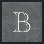 Monogram Elegant Black Stone Texture Stone Coaster<br><div class="desc">An elegant looking black marbled stone texture. Cuts,  scrapes,  scarring and random marks give it depth and personality. Personalize with your initial / monogram in a bold white font.</div>