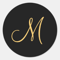 Monogram , gold coloured initial M on black,