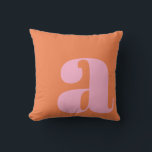 Monogram Initial Letter Bold Pink Orange Playful Throw Pillow<br><div class="desc">A bold and stylish throw pillow featuring a warm orange background with a large pink lowercase letter in modern typography. This eye-catching design adds a playful yet sophisticated touch to any space, making it perfect for contemporary, mid-century, or eclectic home decor. A great statement piece for living rooms, bedrooms, or...</div>