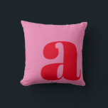 Monogram Initial Letter Bold Pink Red Playful Throw Pillow<br><div class="desc">A bold and stylish throw pillow featuring a warm pink background with a large red lowercase letter in modern typography. This eye-catching design adds a playful yet sophisticated touch to any space, making it perfect for contemporary, mid-century, or eclectic home decor. A great statement piece for living rooms, bedrooms, or...</div>