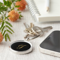 Monogram J, gold coloured initial J on black 
