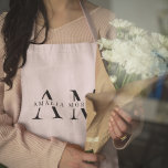 Monogram Pastel Pink Personalized Apron<br><div class="desc">Add a touch of elegance to your kitchen attire with this Monogram Pastel Pink Personalized Apron. Featuring a soft pastel pink hue and a customizable monogram, this apron is perfect for those who love to cook in style. Made from high-quality materials, it offers both comfort and durability, making it ideal...</div>