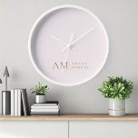 Monogram Personalized Pink Initial And Name  Clock<br><div class="desc">Add a touch of elegance to your space with our Minimalistic Monogram Personalized Pastel Pink Wall Clock. Featuring a soft pastel pink background, this sophisticated clock is adorned with a sleek monogram initial and your custom name in a modern font. Perfect for any room in your home or office, this...</div>