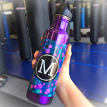 Monogram purple turquoise blue confetti dots teal 710 ml water bottle<br><div class="desc">Sparkly turquoise blue, purple, pink, and green confetti dots on a dark teal background adorn this chic, modern monogramed stainless steel water bottle. Add a sense of style to your workout. Makes a fun statement every time you use it. Customize the bottle colour with one of 10 colours or leave...</div>