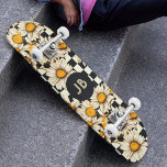 Monogram Retro Groovy Daisy Chequerboard Skateboard<br><div class="desc">Monogram Retro Groovy Daisy Chequerboard Skateboard features a groovy daisy pattern on a black and white chequerboard pattern background with your custom text or personalized initials in the centre. Perfect as a gift for family and friends for Christmas,  birthday,  holidays,  work colleagues and more. Created by ©Evco Studio www.zazzle.com/store/evcostudio</div>