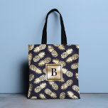 Monogram Tropical Pineapple Girly Gold Navy Tote Bag<br><div class="desc">This modern tropical design features gold pineapples on a navy blue background with your personalized monogram in the centre. Personalize by editing the text in the text box provided. #monogram #monogrammed #initial #personalized #tropical #pineapple #girly #feminine #fruit #gold #navy #navyblue #golden #chic stylish #elegant #feminine #giftsforher #blue #accessories #tote #bags...</div>