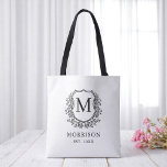 Monogram White Black Crest Botanical Wedding  Tote Bag<br><div class="desc">Make a timeless statement with our Monogram White Black Crest Botanical Wedding Tote Bag. Featuring a clean white background, a sophisticated black botanical crest, and your personalized monogram, this tote offers a perfect blend of classic style and modern design. Ideal for welcome bags, bridal party gifts, or guest favours, it’s...</div>