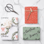 Monogram Wreath Merry Christmas Holiday Wrapping Paper Sheet<br><div class="desc">This cute holiday wrapping paper features a set of 3 different designs of wrapping papers. 1. A white background with a monogram and a greenery wreath. 2. A red background with snow patterns. 3. A mos green background with "merry christmas" in script lettering. Change the background colour and personalize it...</div>