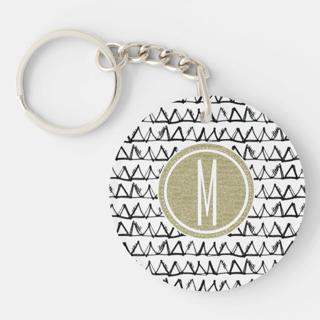 Monogramme noir de parties scintillantes d'or de (Devant)
