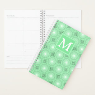 Monogramme vert ressort cercles motif