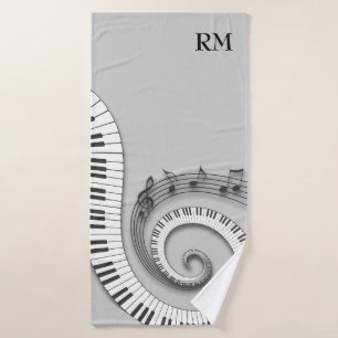 Monogrammed curved piano keys and musical notes on bath towel set