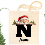 Monogrammed Family Christmas Personalized Santa Tote Bag<br><div class="desc">Celebrate the magic of Christmas with our Monogrammed Family Christmas Personalized Santa Tote Bag, the perfect accessory for spreading festive cheer. This delightful tote bag is a thoughtful and personalized family reunion gift, featuring a charming monogrammed design that adds a touch of warmth to your holiday festivities. Designed for both...</div>