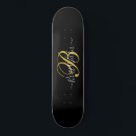 Monogrammed Gold Black Skateboard<br><div class="desc">A stylish gold monogram on black skateboard in a script typography name and initial.</div>