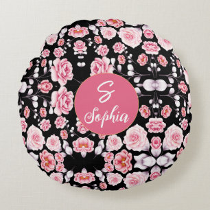 Monogrammed pink floral pattern on black round pillow