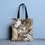 Monogrammed Tropical Floral Gold Navy Tote Bag<br><div class="desc">This modern chic design features your monogram on a background of a tropical floral pattern in gold and navy blue. #floral #tropical #navy #navyblue #gold #golden #botanical #foliage #personalized #monogram #monogrammed #initial #elegant #chic #stylish #modern #girly #feminine#tote #bags #totebags #accessories #office #work #school #giftsforher #personalizedgifts</div>