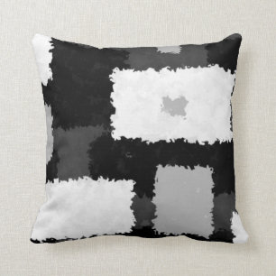 Monotone dans des coussins gris, noirs et blancs