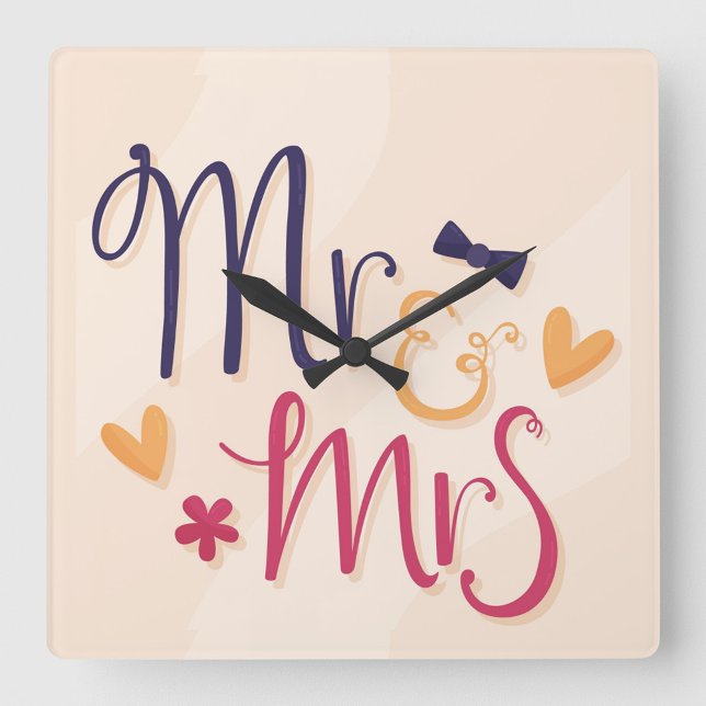 Monsieur et Madame Horloge murale en acrylique (Square wall clock with the words "Mr. & Mrs" in a playful, cartoonish font.)