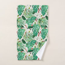 Monstera leaves and palm leaves on terazzo backgro