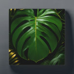 Monstera Leaves Gold Jungle Glamour Plaque<br><div class="desc">Indulge in sophisticated jungle opulence with this stunning high-contrast botanical! Oversized, glossy Monstera leaves gleam in deep emerald green with luxurious metallic-gold veins and delicate gold outlining, set against a dramatic inky black backdrop. Layered palm fronds add depth and richness, creating an instantly glamorous, modern-tropical statement that exudes elegance and...</div>