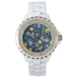 Montre Branches de citron avec fleurs et fruits sur le bl