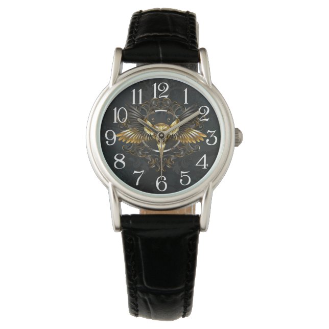 Montre Crâne d'oiseaux dorés sur arrière - plan noir (devant)