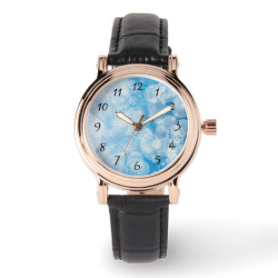 Montre flocons de Noël sur un fond bleu        