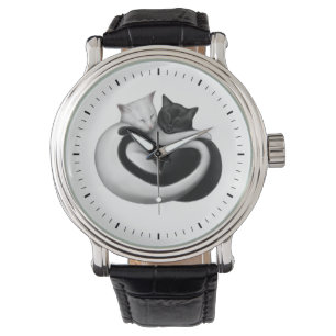 Montre noire et blanche de chats d'amour