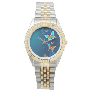 Montre Papillons d'or sur un Arrière - plan bleu