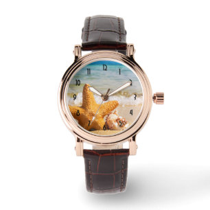 Montre Poisson étoilé et coquillages sur la plage