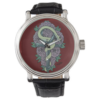 Montre Snake enveloppé autour du tatouage de cheville par