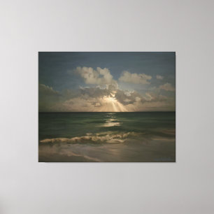 Moon behind clouds over ocean with waves canvas print