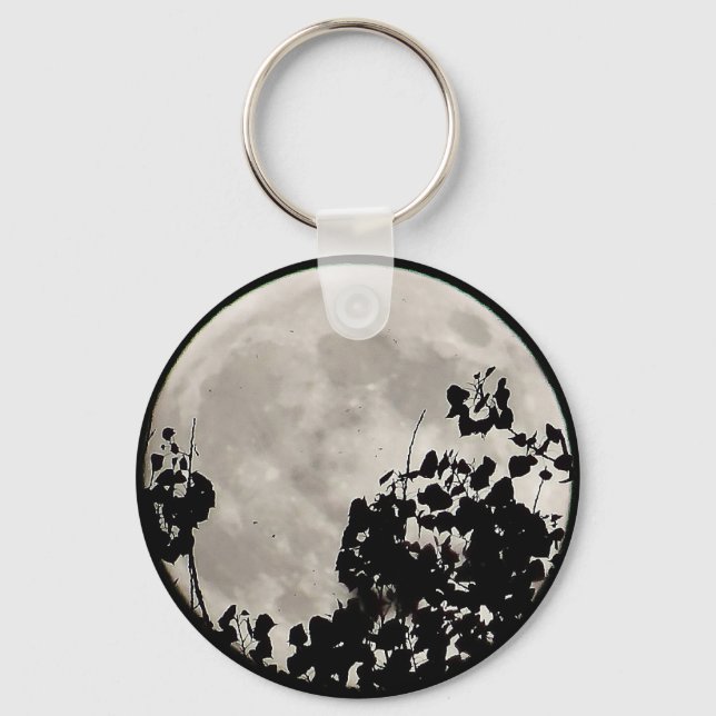 Moon behind dark leaves keychain (Front)