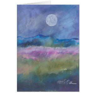 Moon over desert field.