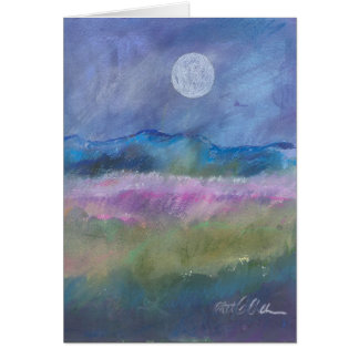 Moon over desert field.