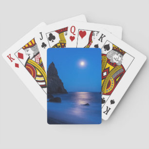 Moonrise reflection on ocean and sea stacks playing cards