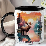 Moose at Sunset Lake Reflection Mug<br><div class="desc">Add a touch of wilderness to your morning routine with the Moose at Sunset Lake Reflection Mug. This stunning mug features a majestic moose standing in a serene lake at sunset, with the vibrant colours of the setting sun and the tranquil forest beautifully reflected in the water. Customized with your...</div>