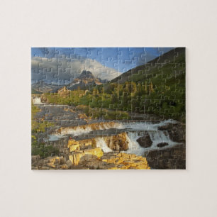 Morning light greets Swiftcurrent Falls in the Jigsaw Puzzle
