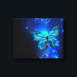 Morpho Butterfly in the Dark Background Canvas Print<br><div class="desc">blue,  glowing butterflies morpho on a dark background. Morpho. Design with butterflies.</div>