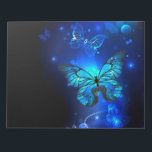 Morpho Butterfly in the Dark Background Notepad<br><div class="desc">blue,  glowing butterflies morpho on a dark background. Morpho. Design with butterflies.</div>