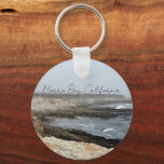Morro Bay California Coastal Photography Keychain<br><div class="desc">A foggy overcast day in Morro Bay California with the ocean waves hitting the rocks on the shore in this beach photograph souvenir. This seaside travel photo keepsake keychain features black cursive script above the beach rocks and grey sky.</div>
