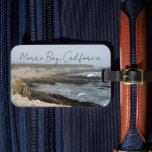 Morro Bay California Ocean Cliffs Photography Luggage Tag<br><div class="desc">A foggy overcast day in Morro Bay California with the ocean waves hitting the rocks on the shore in this beach photograph souvenir. This seaside travel photo luggage tag features black cursive script above the beach rocks and grey sky.</div>