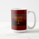 Moshe's Menorah Coffee Mug<br><div class="desc">In the Torah Moshe Rabbenu is told, "You shall make a Menorah of pure gold, beaten out, shall the Menorah be made, its base, its branch, its goblets, its knobs, and its flowers shall be hammered from it, " [Shmot 25:31] and later, "See, and construct, according to their form that...</div>