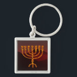 Moshe's Menorah Keychain<br><div class="desc">In the Torah Moshe Rabbenu is told, "You shall make a Menorah of pure gold, beaten out, shall the Menorah be made, its base, its branch, its goblets, its knobs, and its flowers shall be hammered from it, " [Shmot 25:31] and later, "See, and construct, according to their form that...</div>