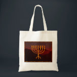 Moshe's Menorah Tote Bag<br><div class="desc">In the Torah Moshe Rabbenu is told, "You shall make a Menorah of pure gold, beaten out, shall the Menorah be made, its base, its branch, its goblets, its knobs, and its flowers shall be hammered from it, " [Shmot 25:31] and later, "See, and construct, according to their form that...</div>