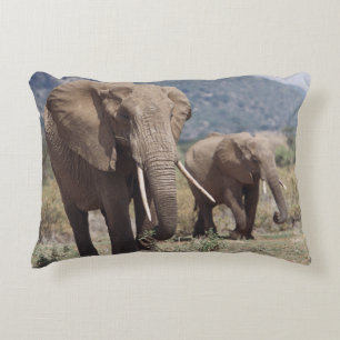 Mother elephant walking with elephant calf accent pillow