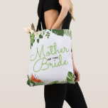 Mother of the Bride Tropical Destination Wedding Tote Bag<br><div class="desc">Modern 'Mother of the Bride' wedding party personalized tote bag- Contemporary, girly botanical tropical palm leaves border. Centred, it reads 'Mother of the Bride' in elegant, green script lettering. Bordered with tropical palm leaves, banana leaves, red Bird of Paradise flower, and creamy white plumeria flower botanical design in shades of...</div>