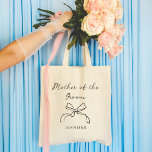 Mother of the Groom | Any Colour Coquette Bow Tote Bag<br><div class="desc">This stylish,  whimsical tote says "Mother of the Groom" in chic,  handwritten script with an illustrated coquette bow and a spot for her name. You can customize the tote by choosing any colour for the text and bow,  so your wedding party can match.</div>