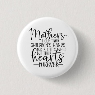 Mothers hold their children’s hand for a little wh 1 inch round button