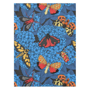 Moths on blue hydrangea tablecloth