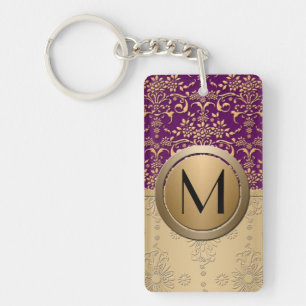 Motif damassé à monogramme or et violet élégant